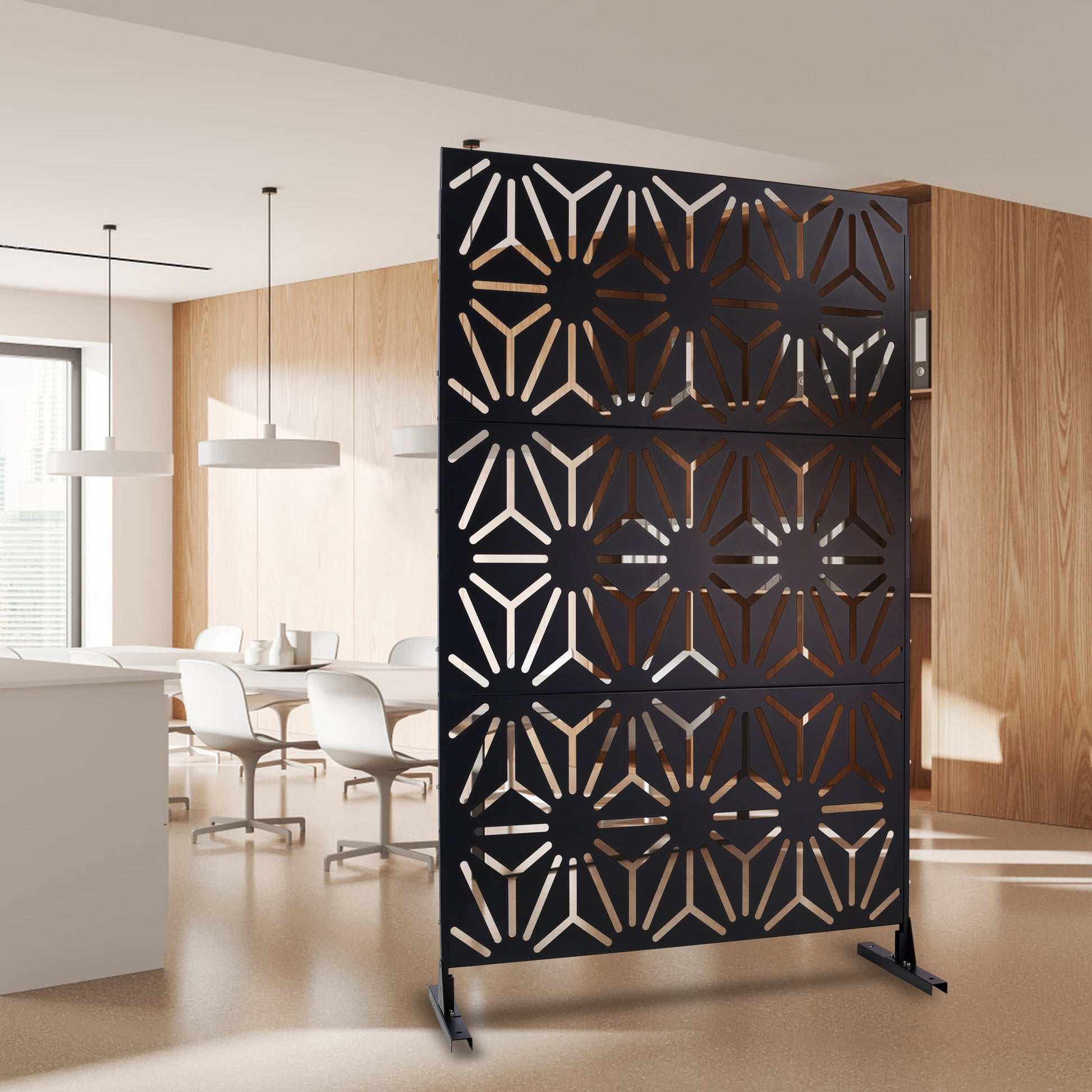Black metal room divider with geometric starburst pattern modern design