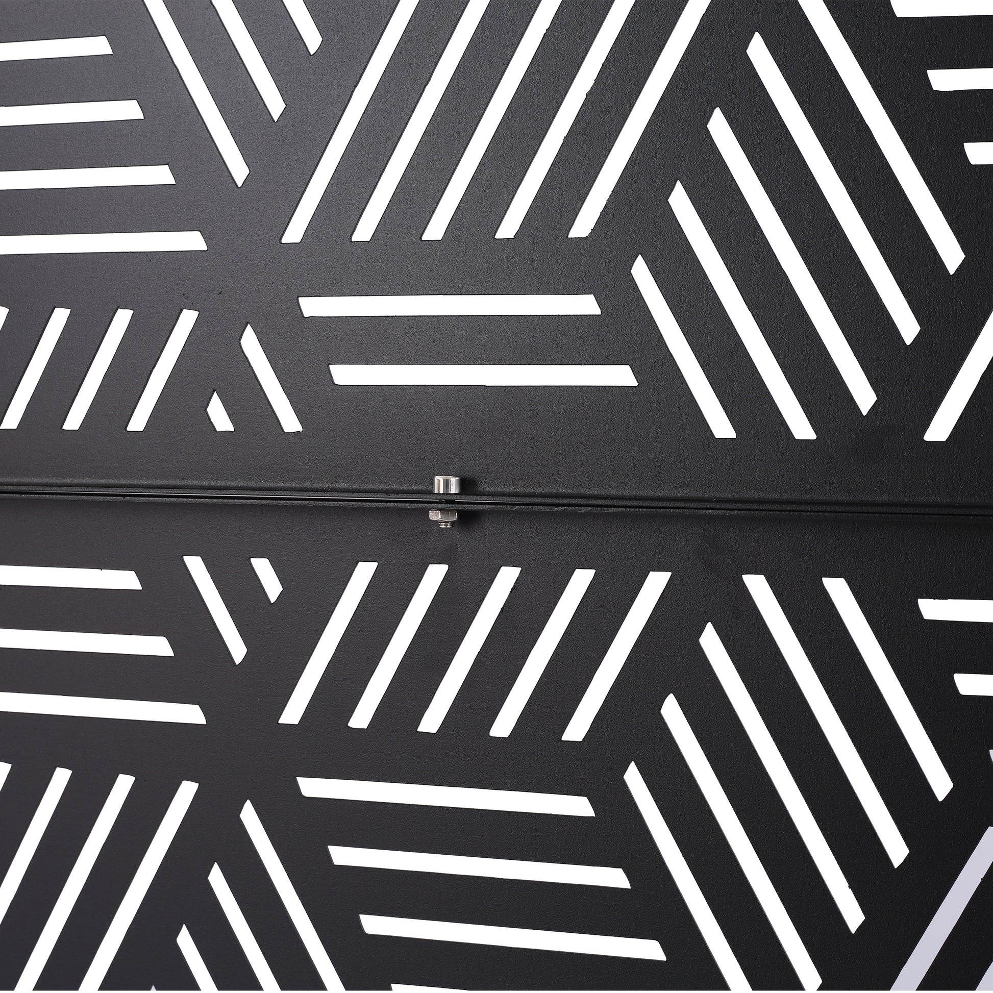 Black metal decorative panel with geometric white cutouts for modern home decor