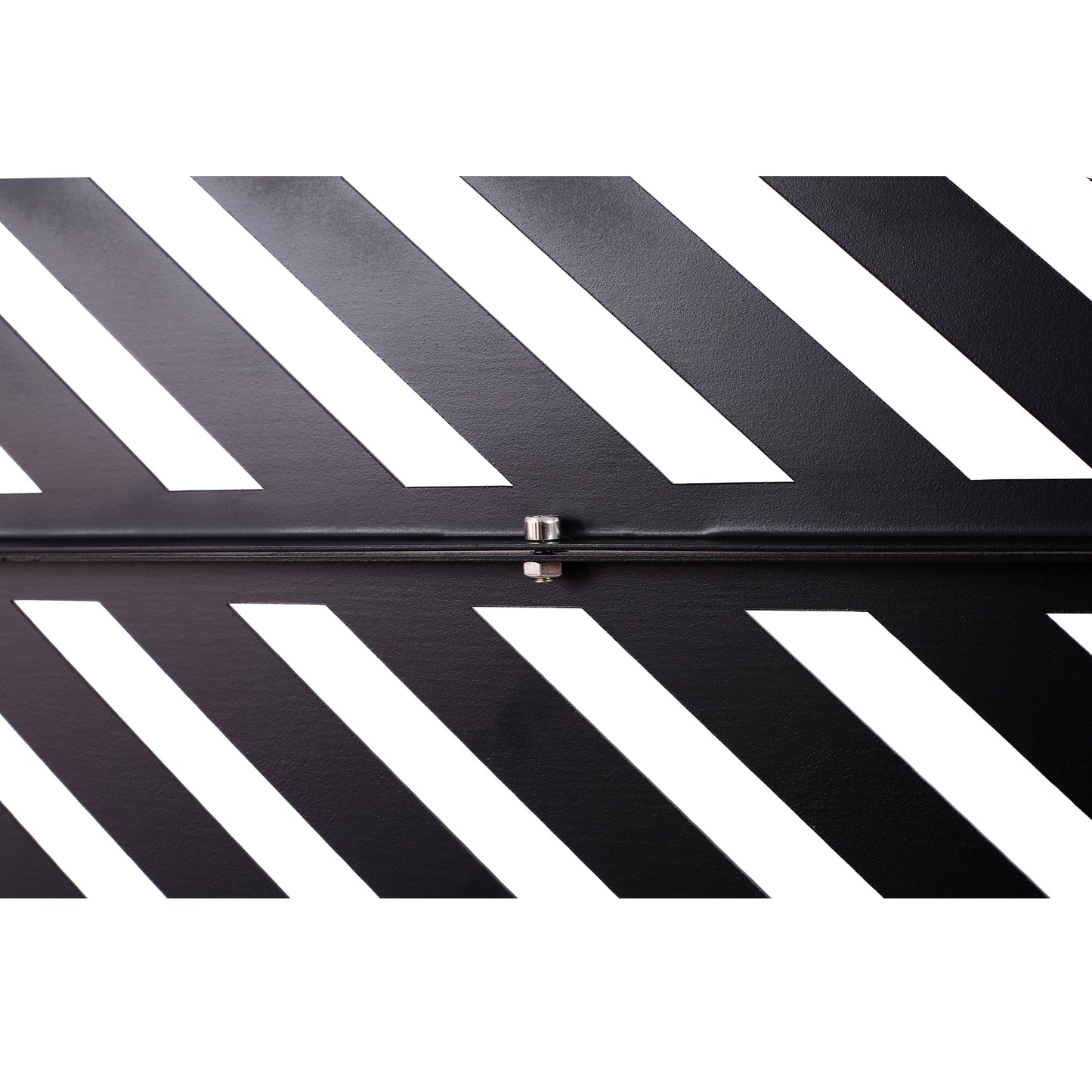 Black metal foot pedal with diagonal white stripes and silver bolt detail