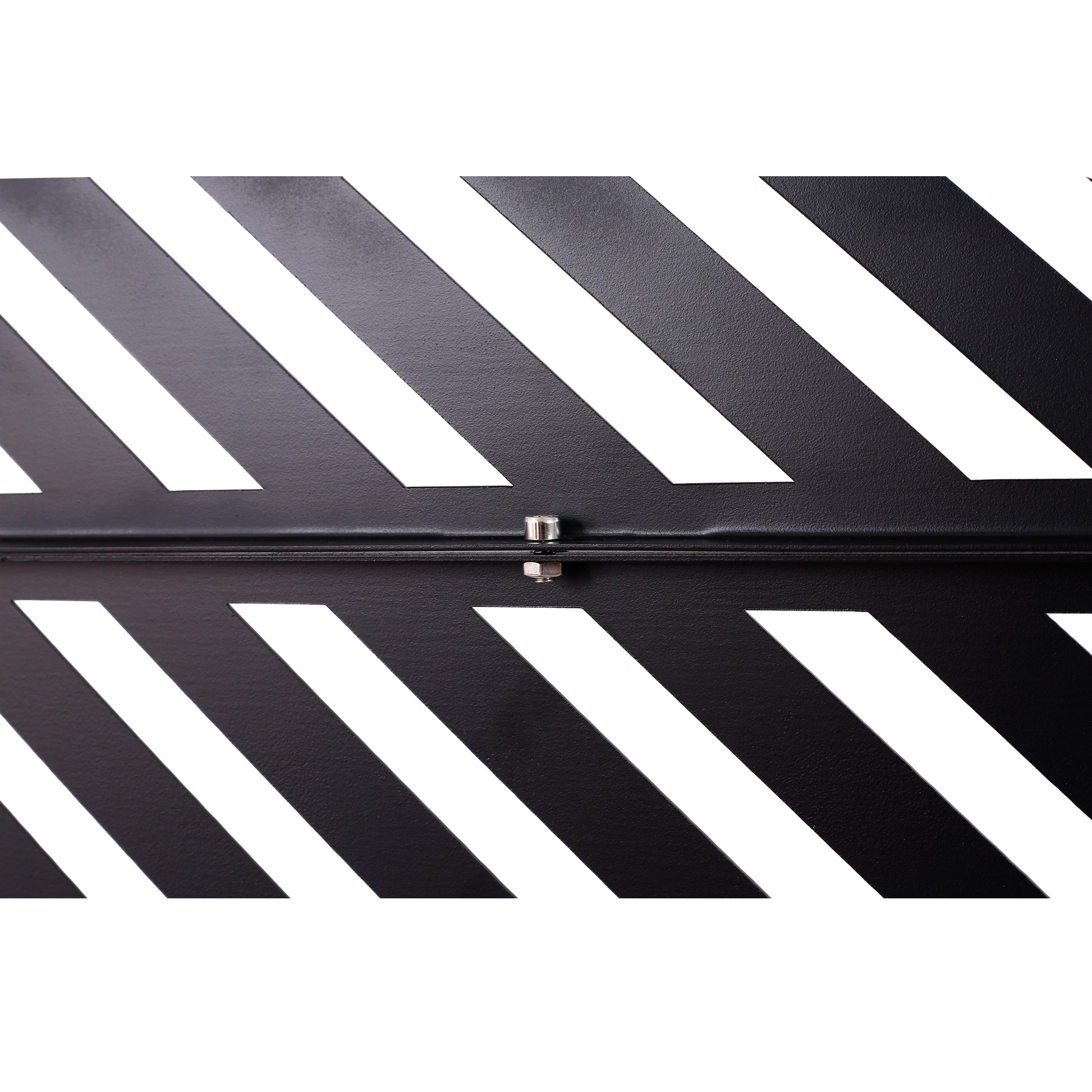 Black metal foot pedal with diagonal white stripes and silver bolt detail