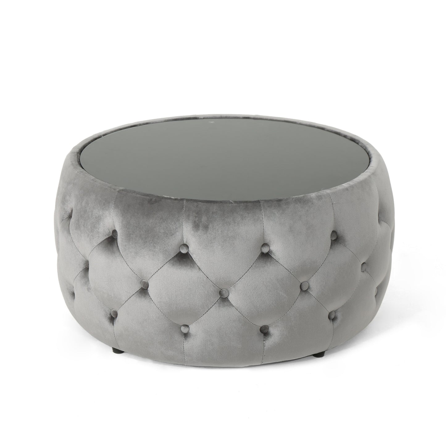 Grey velvet tufted round ottoman with a smoked glass top