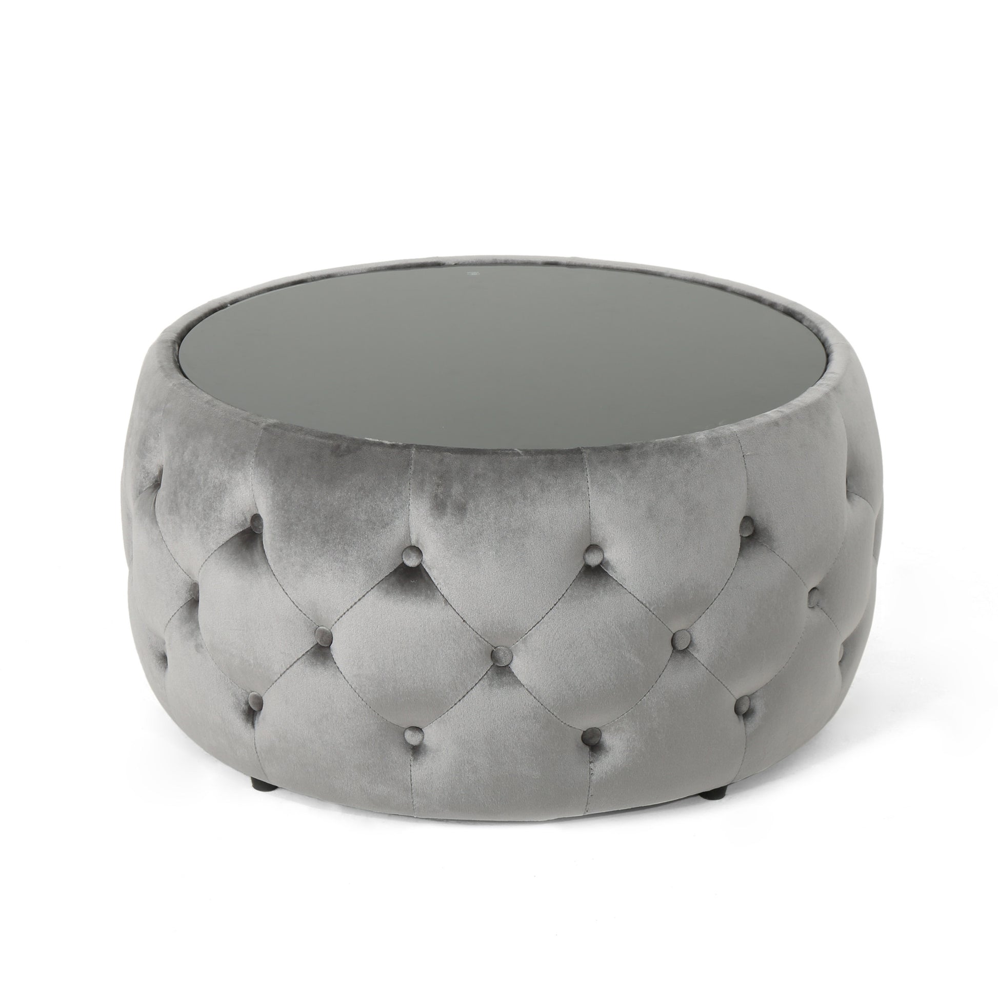 Grey velvet tufted round ottoman with a smoked glass top