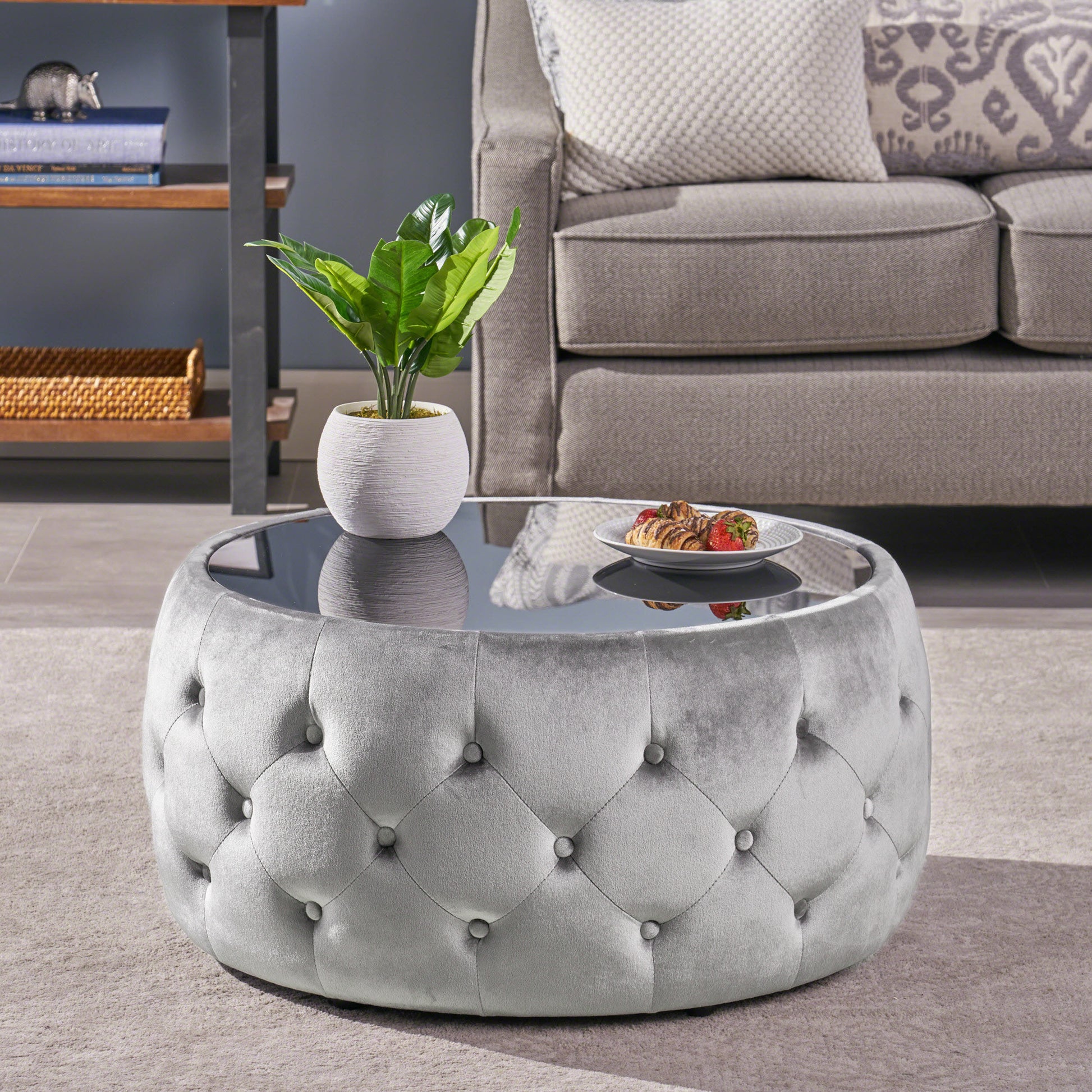 Gray velvet tufted ottoman with glass top