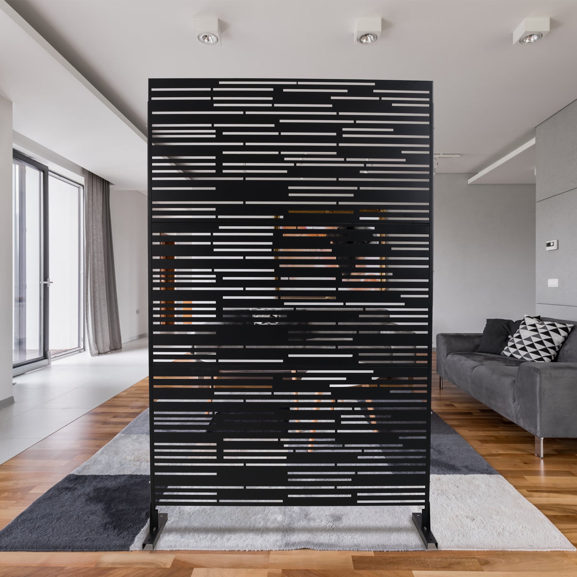 Modern black room divider screen with horizontal slat pattern and metallic accents