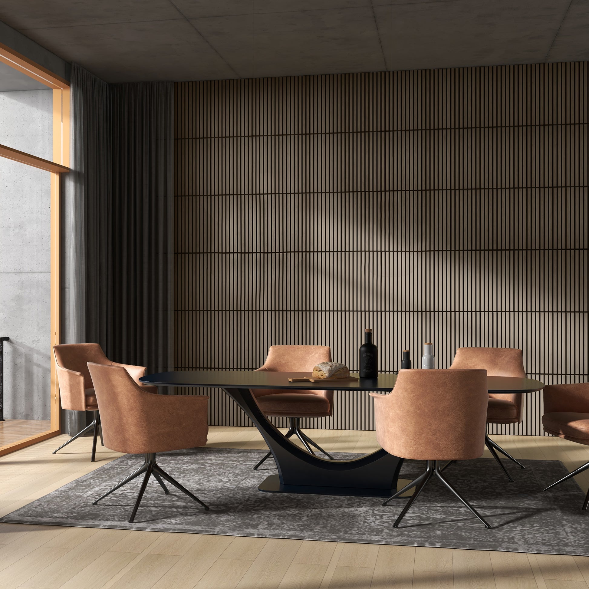 Modern oval dining table with black base and plush rustcolored swivel chairs