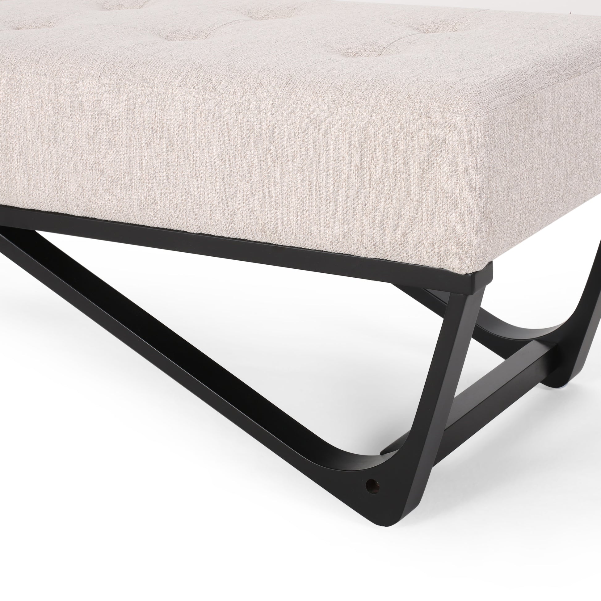 Tufted beige fabric ottoman with curved black metal legs
