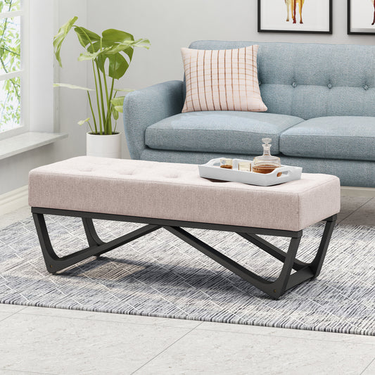 Tufted beige fabric ottoman with modern black metal base