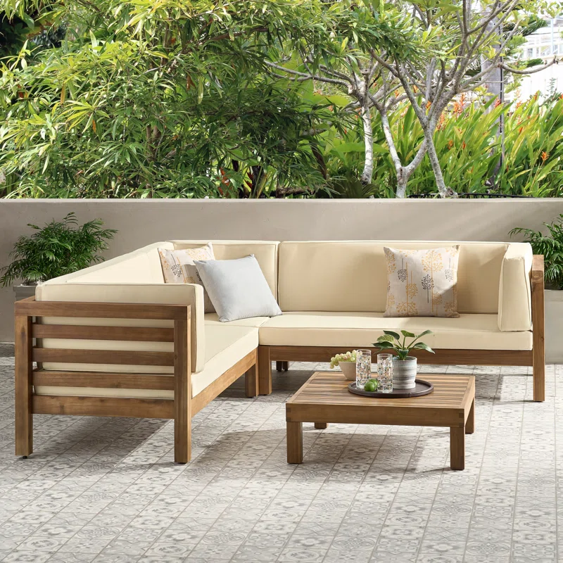 Wood sectional outdoor sofa with beige cushions and a coffee table