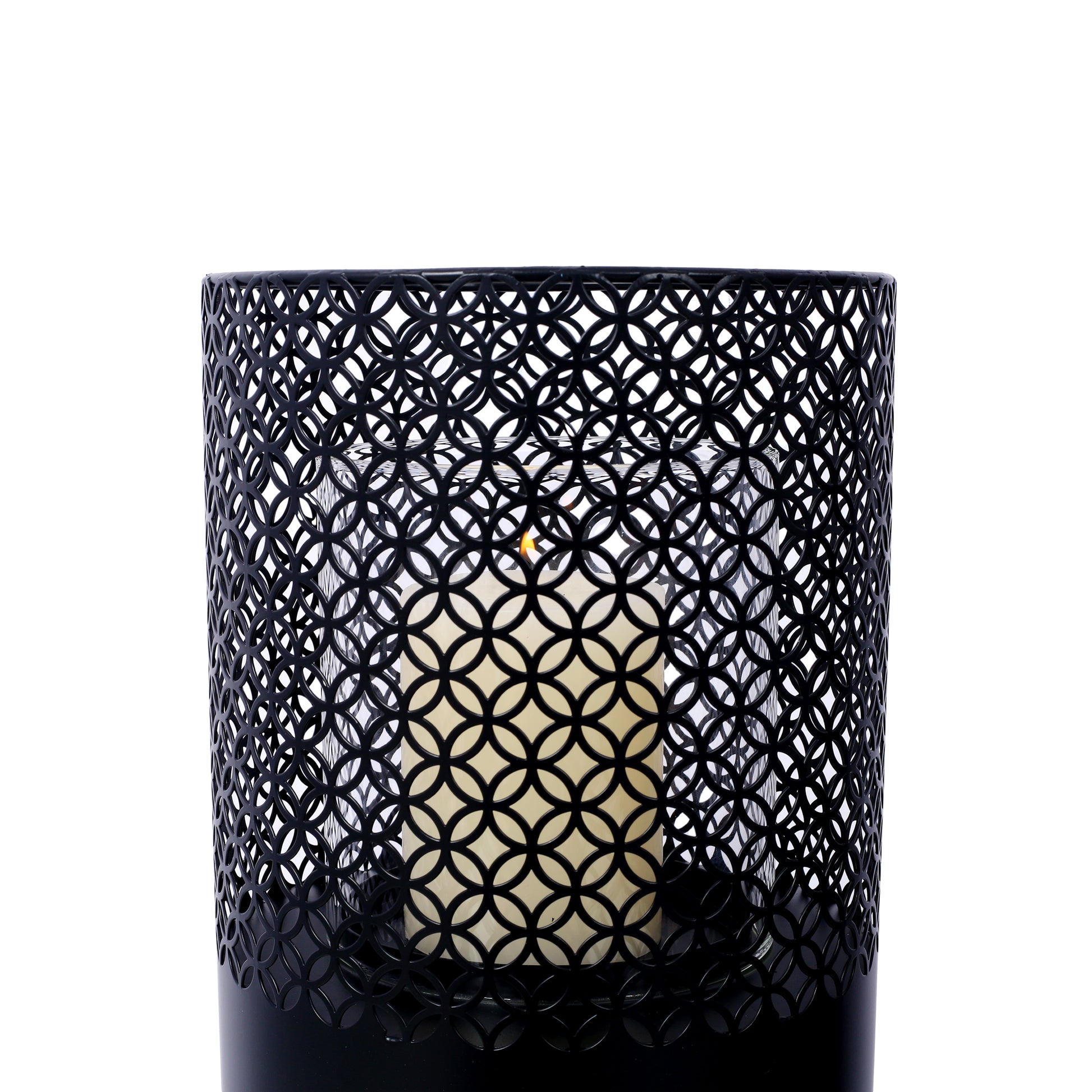 Black metal lantern with intricate geometric pattern and cream candle inside