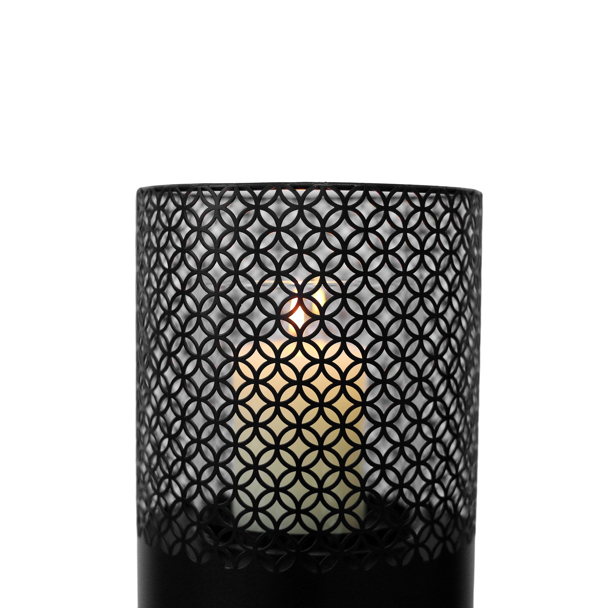 Black metal lantern with intricate circular pattern showcasing a lit candle inside