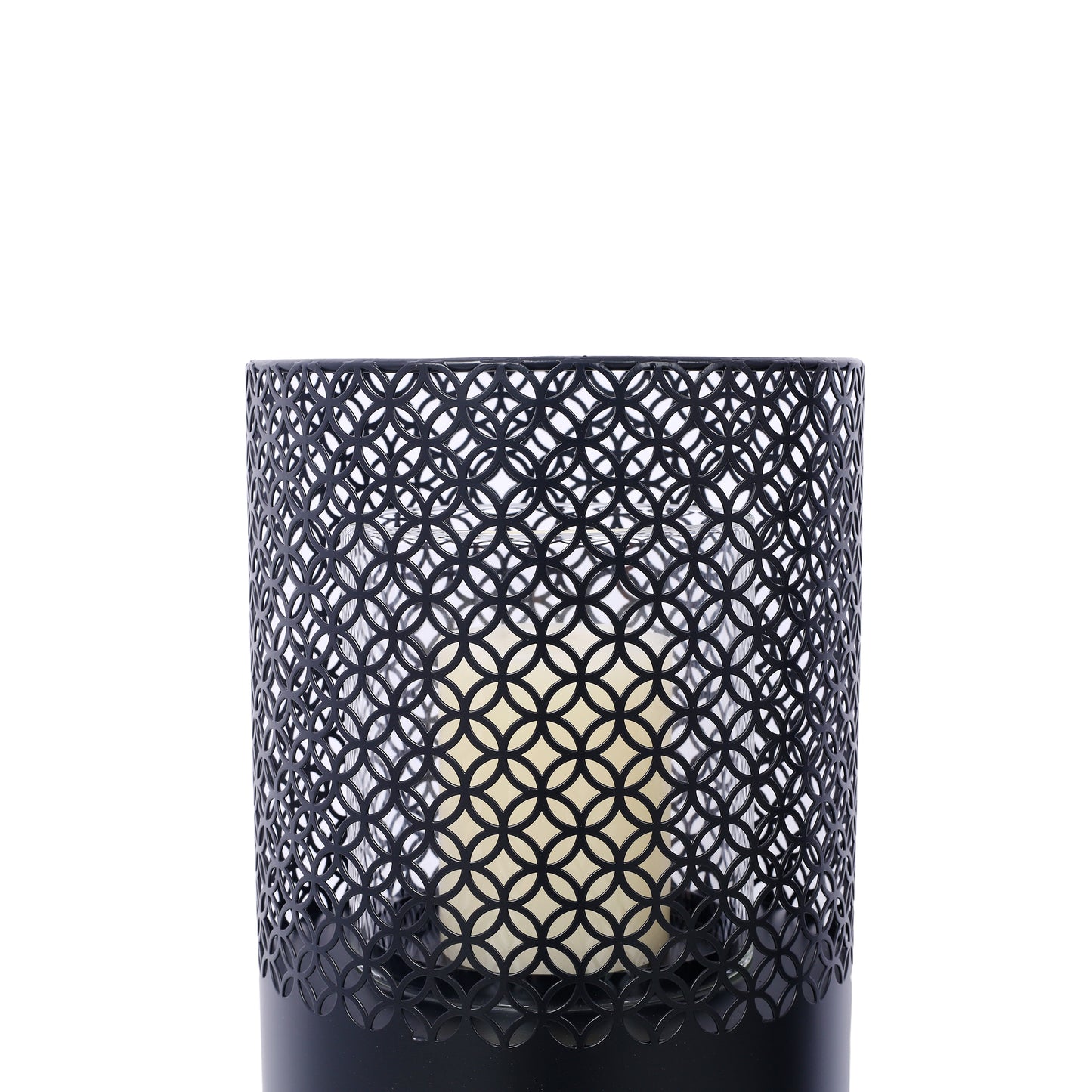 Black metal lantern with intricate geometric cutouts and ivory candle inside