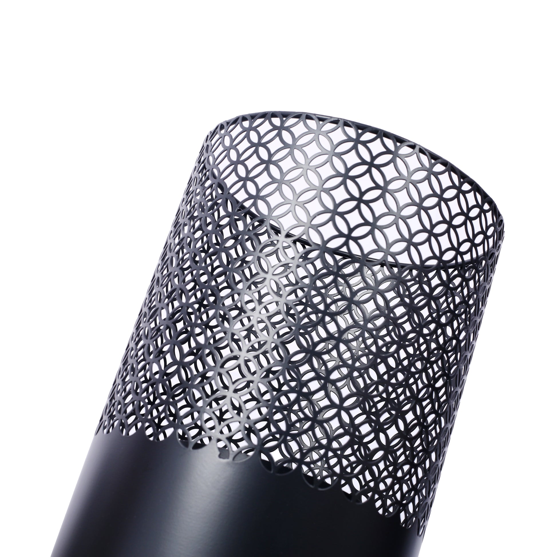 Black metal waste bin with decorative cutout pattern