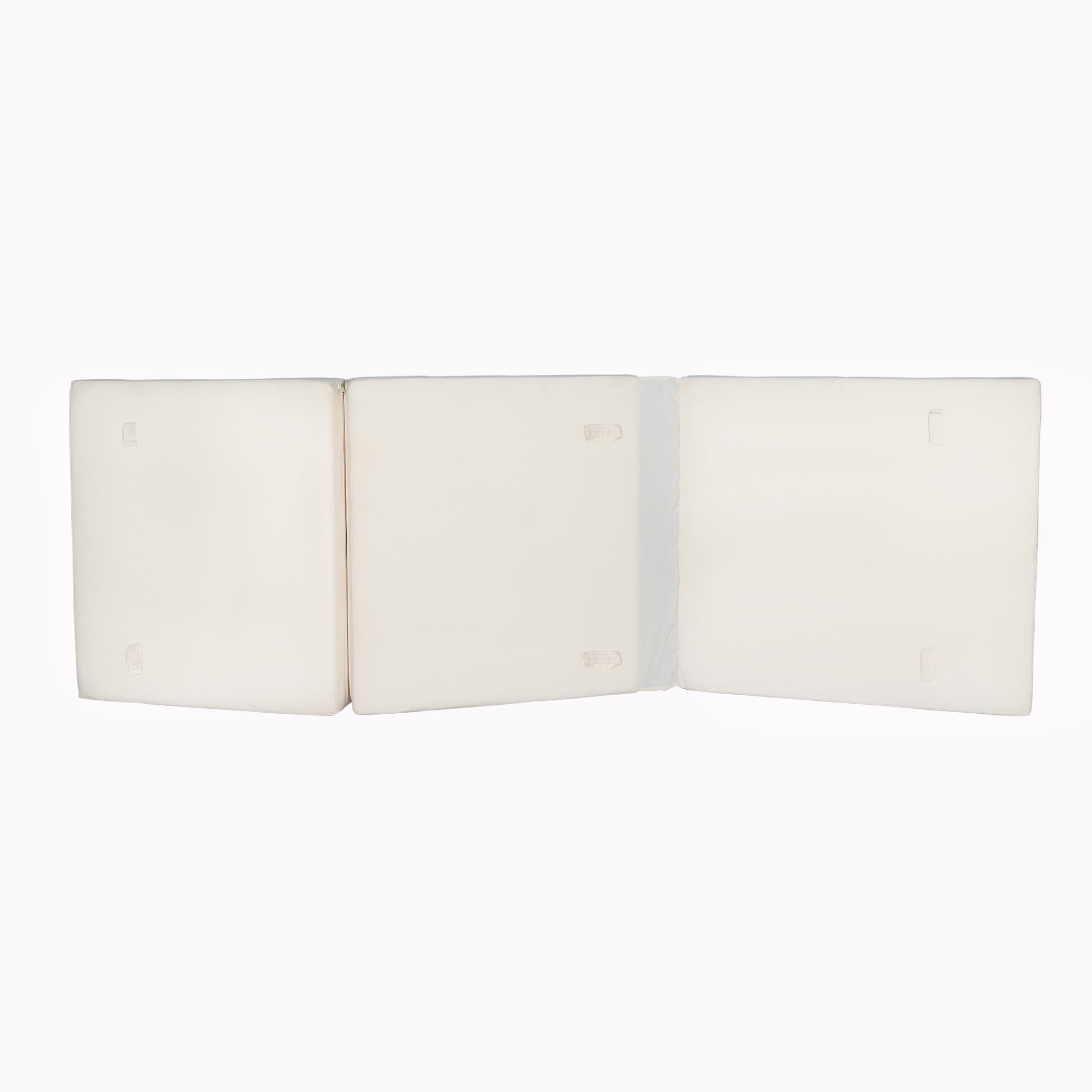 Three white foam floor mattress segments unfolded ready for use