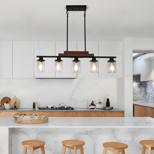 Rustic island pendant light with five clear glass shades and wood accent
