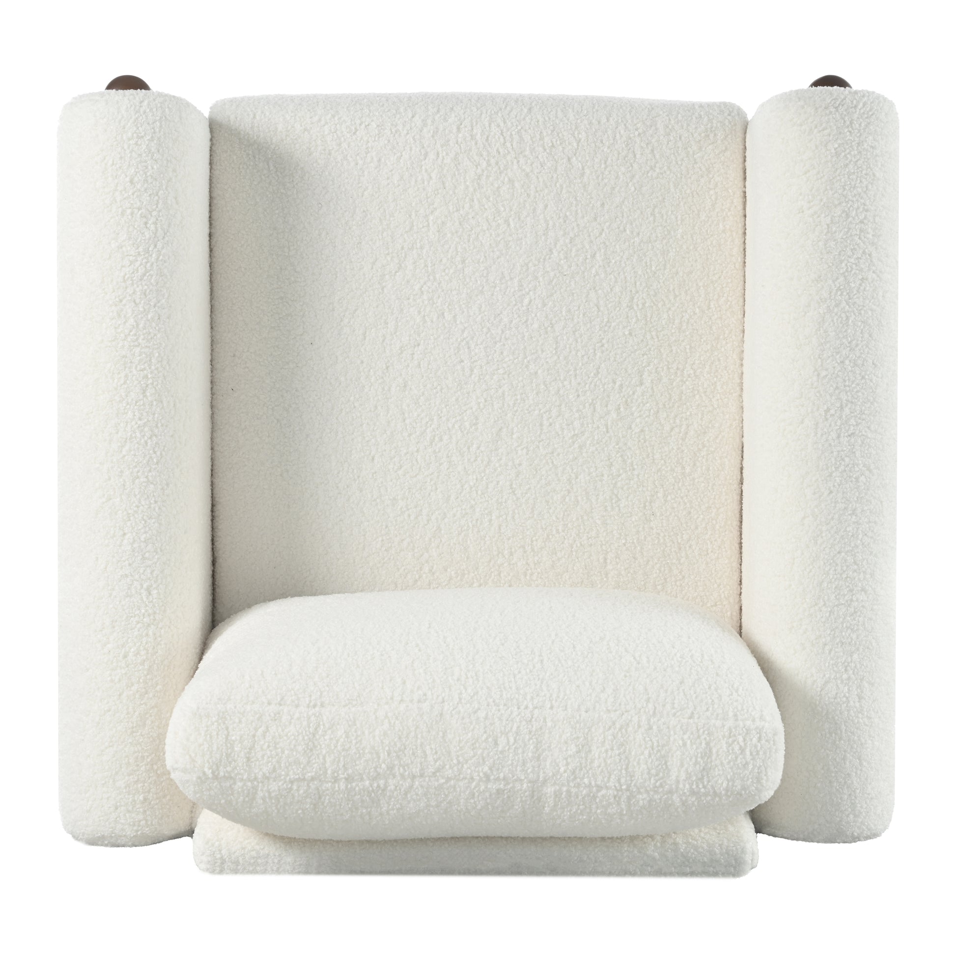 Plush white boucle armchair with curved armrests and a round brown finial detail