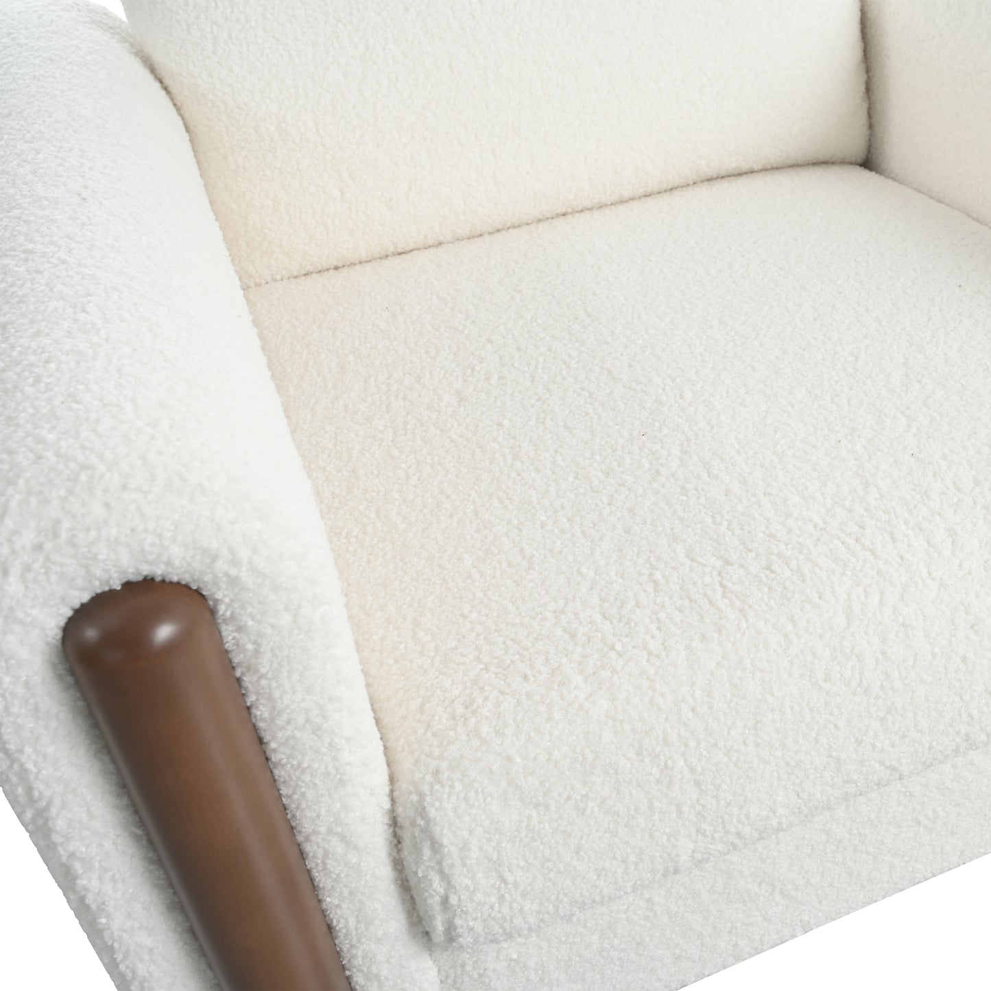 Cream boucle armchair featuring a rich brown wooden armrest accent for modern comfort