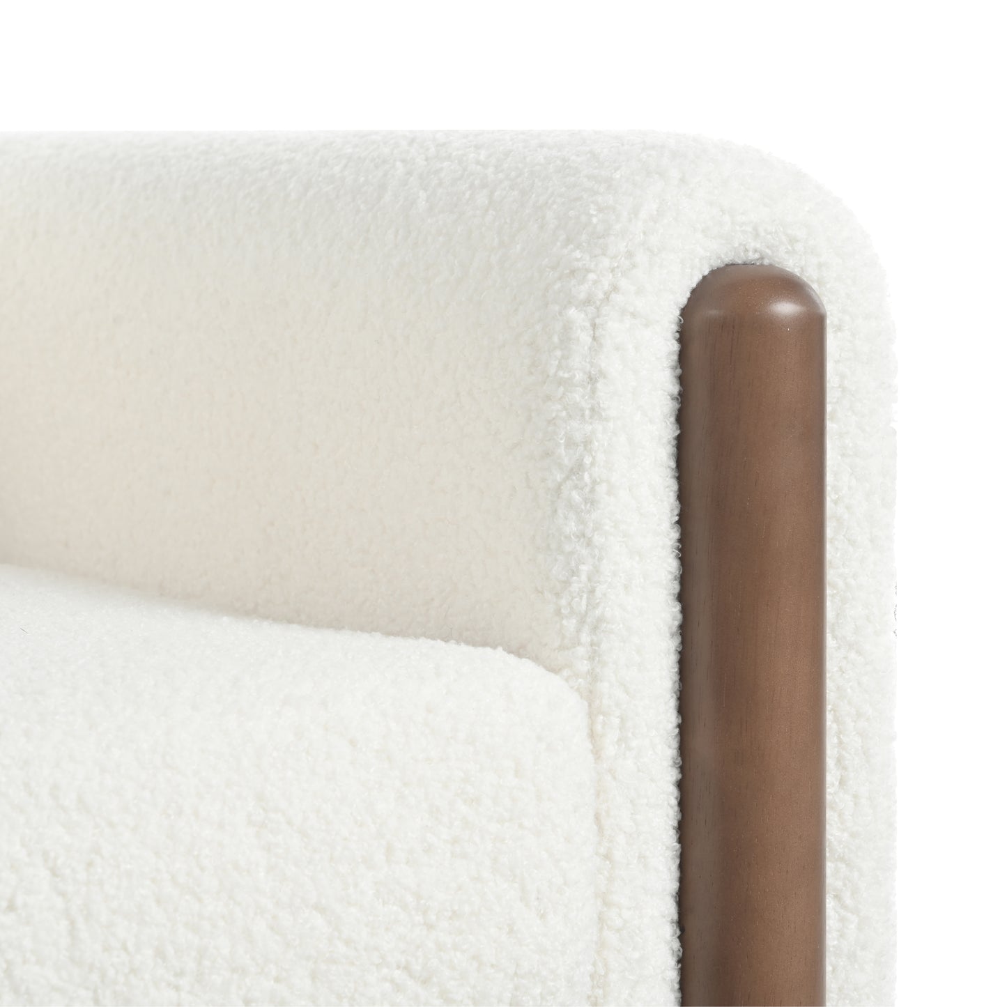 Cream boucle armchair with curved wooden armrest detail