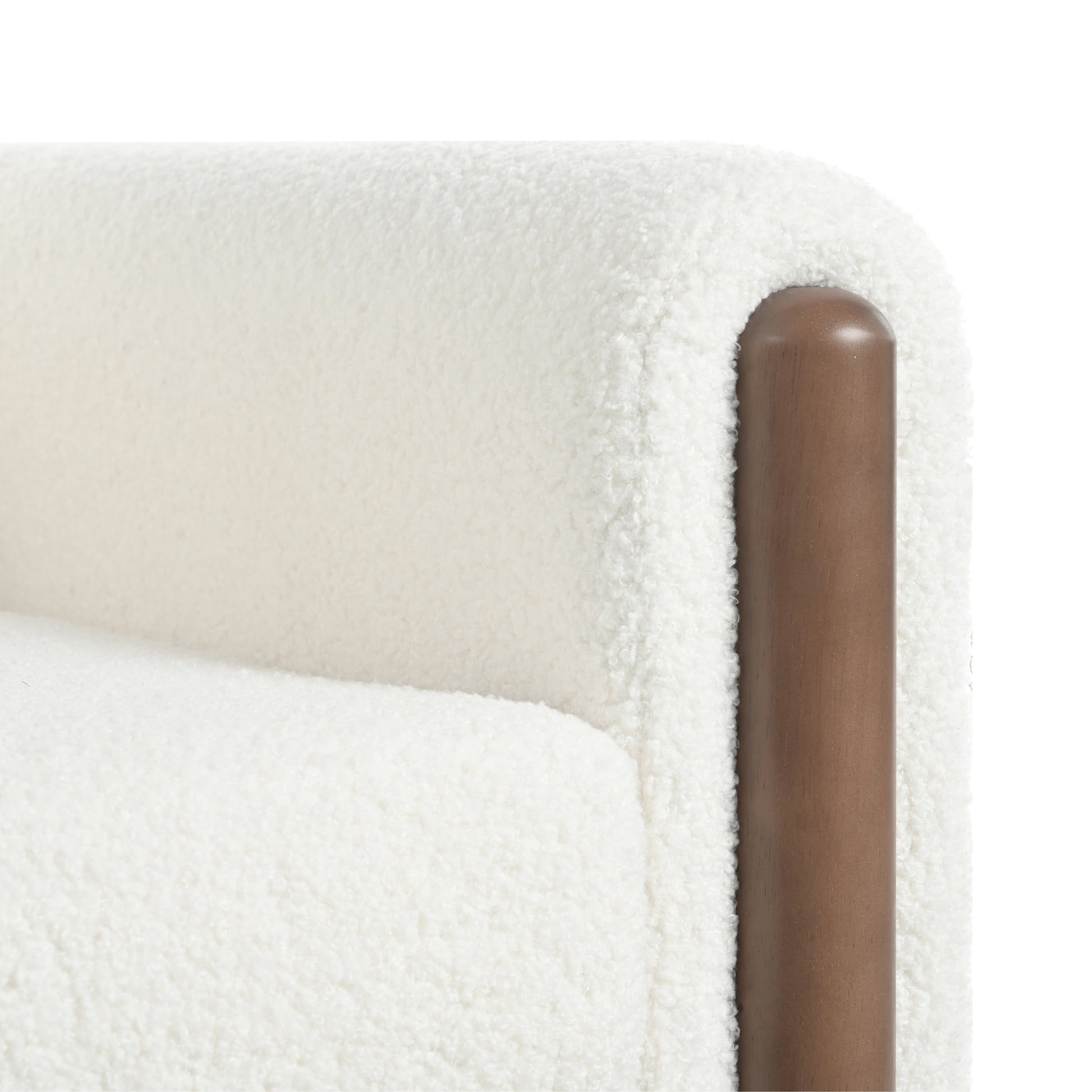Cream boucle armchair with curved wooden armrest detail