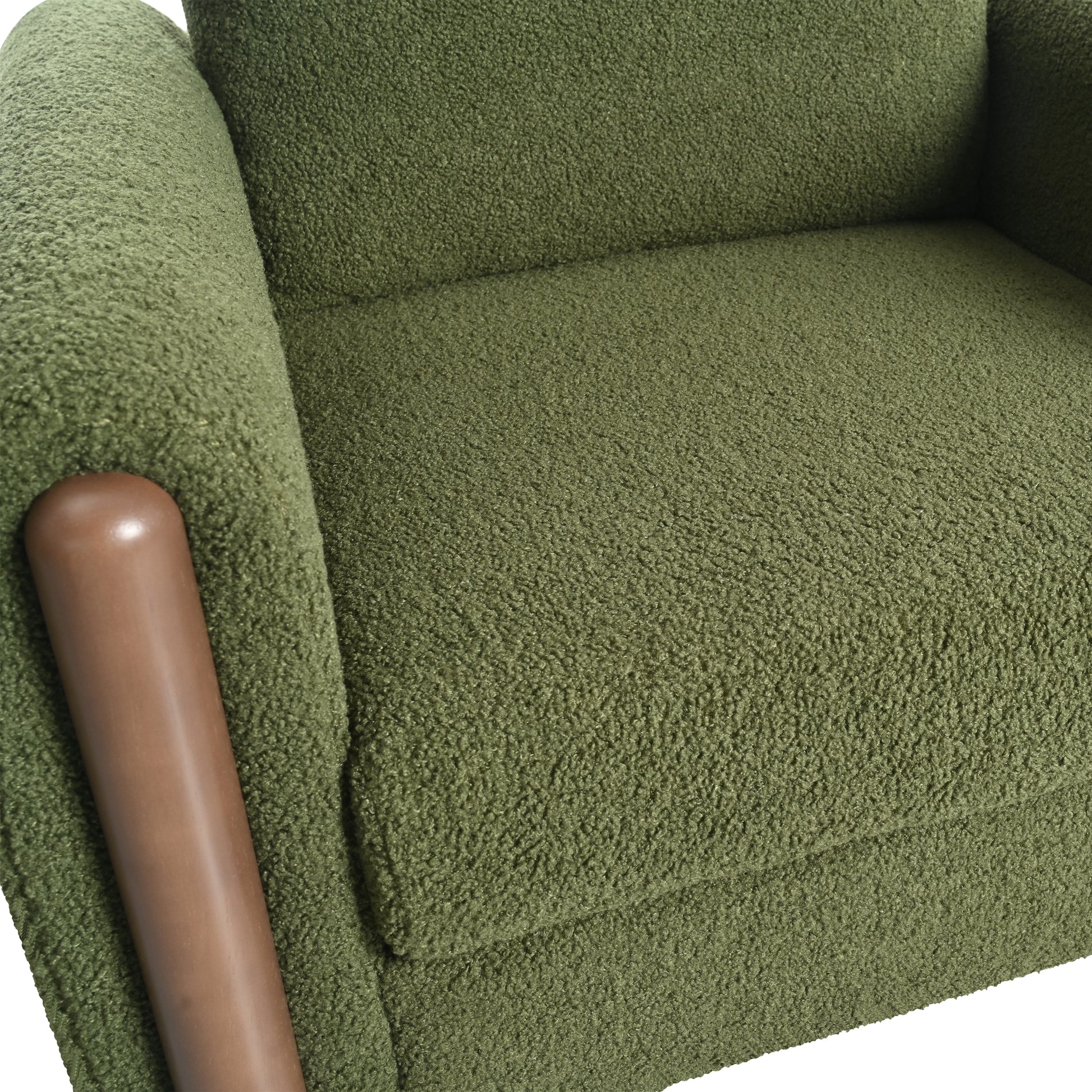 Green boucle armchair with brown wooden armrest detail cozy seating