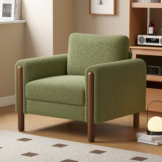Cozy green boucle armchair with rounded wooden legs perfect for a living room accent chair