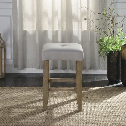 Light grey upholstered bar stool with tufted seat and natural wood legs