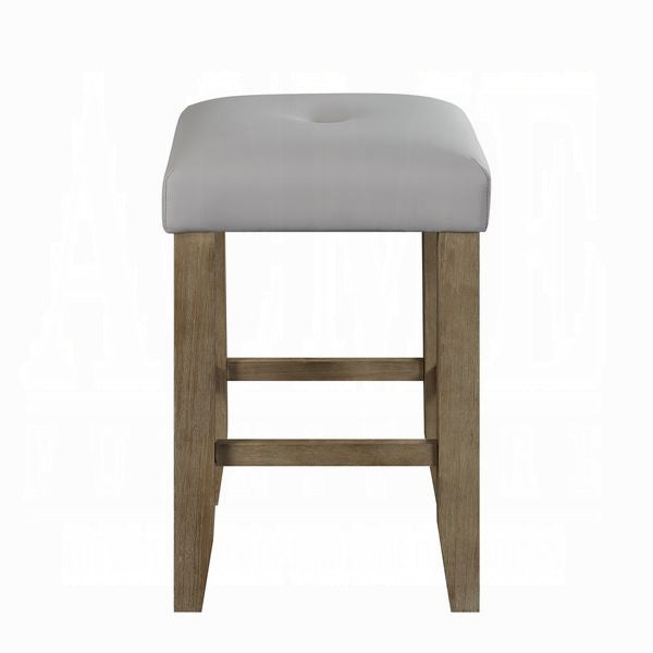 Gray upholstered counter stool with light wood legs and footrest
