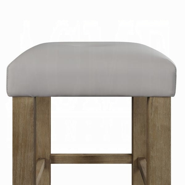 Light gray upholstered counter stool with a natural wood frame