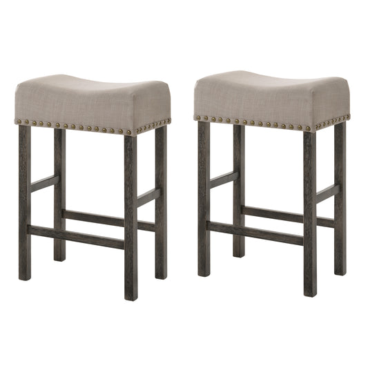 Two beige upholstered saddle bar stools with dark wood legs and brass nailhead trim