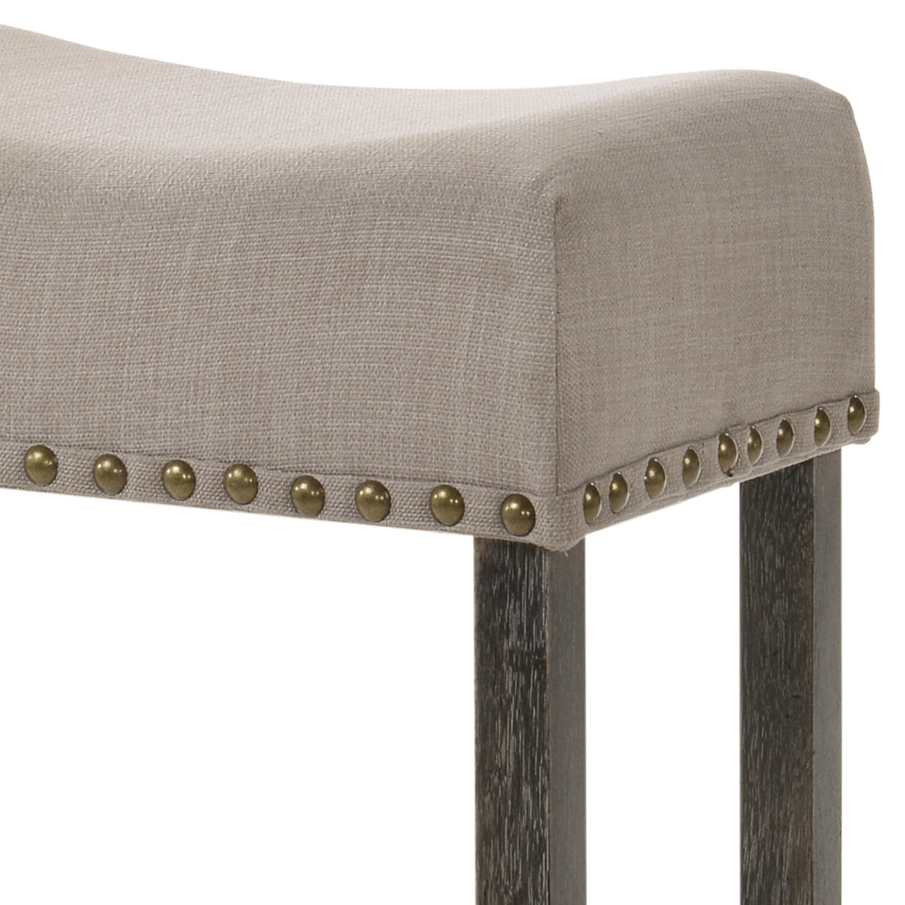 Upholstered bench with neutral fabric and brass nailhead trim