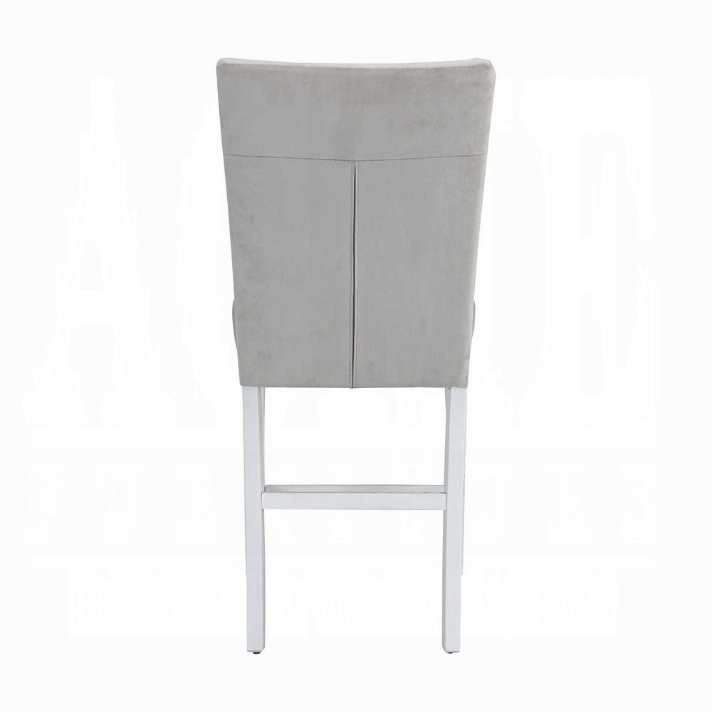 Grey velvet upholstered bar stool with stitched detailing and white wooden legs