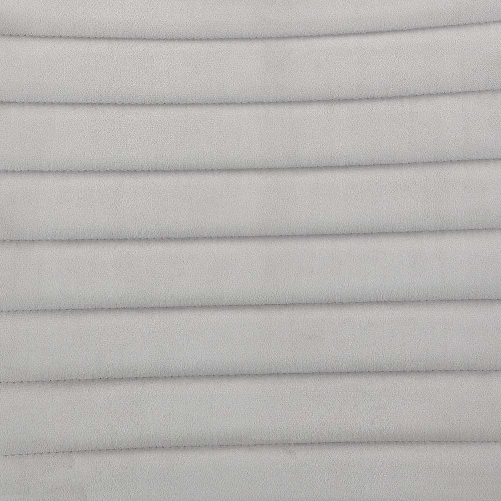 Closeup of light grey fabric with horizontal channel quilting ideal for upholstery