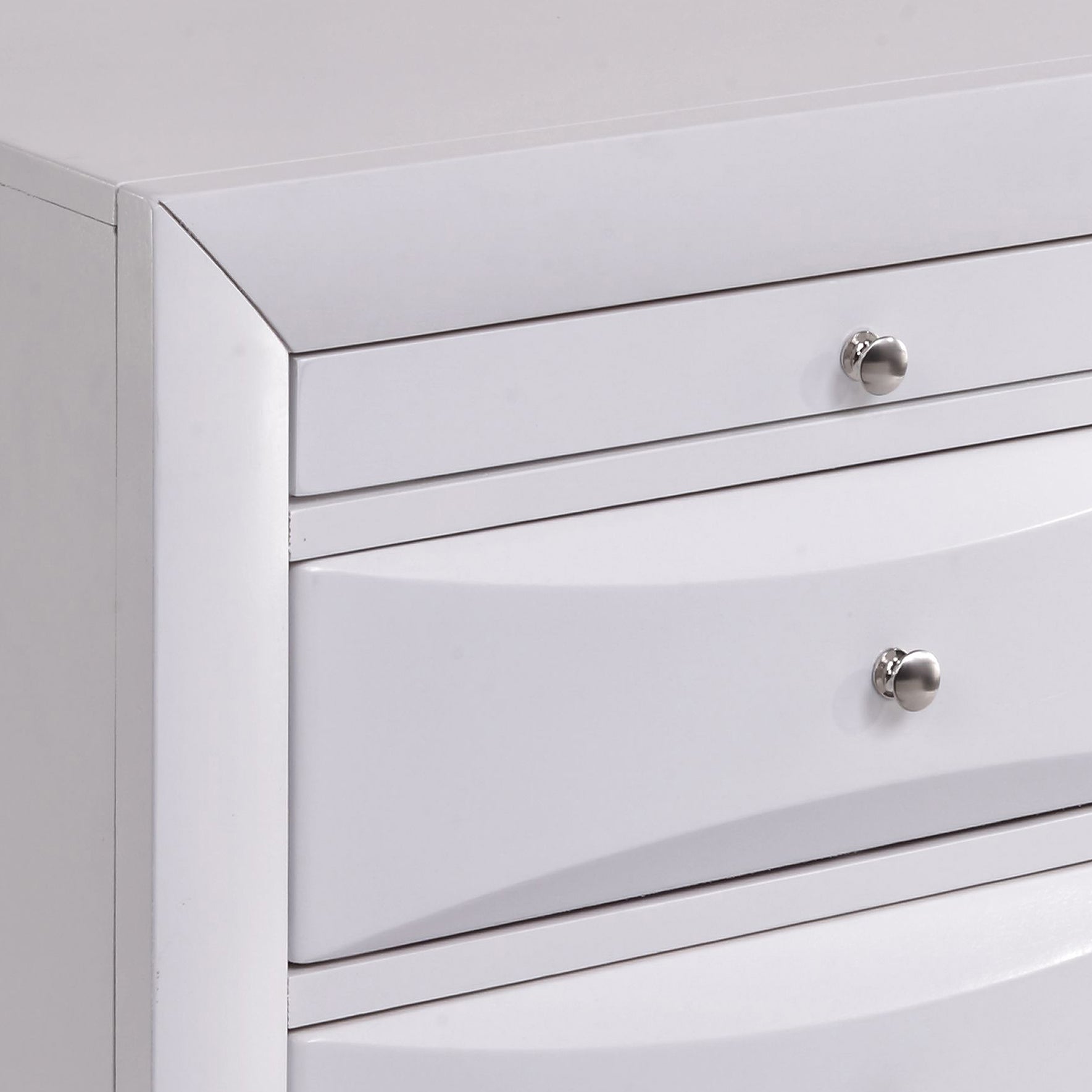 White modern dresser with three smooth drawers and brushed nickel knobs clean design