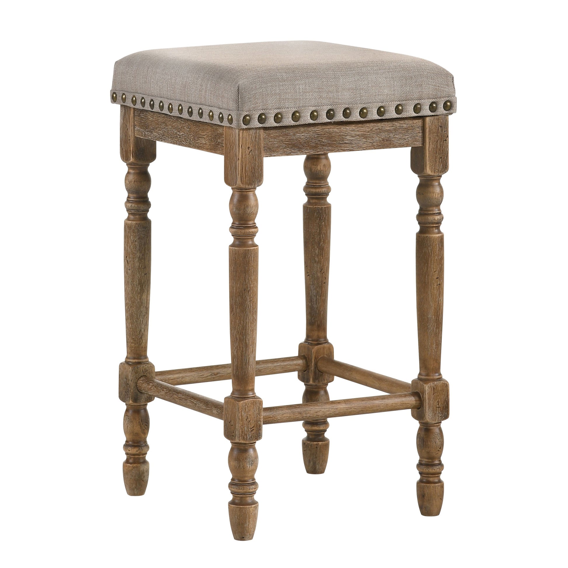 Rustic grey linen bar stool with antique brass nailhead trim and turned wood legs