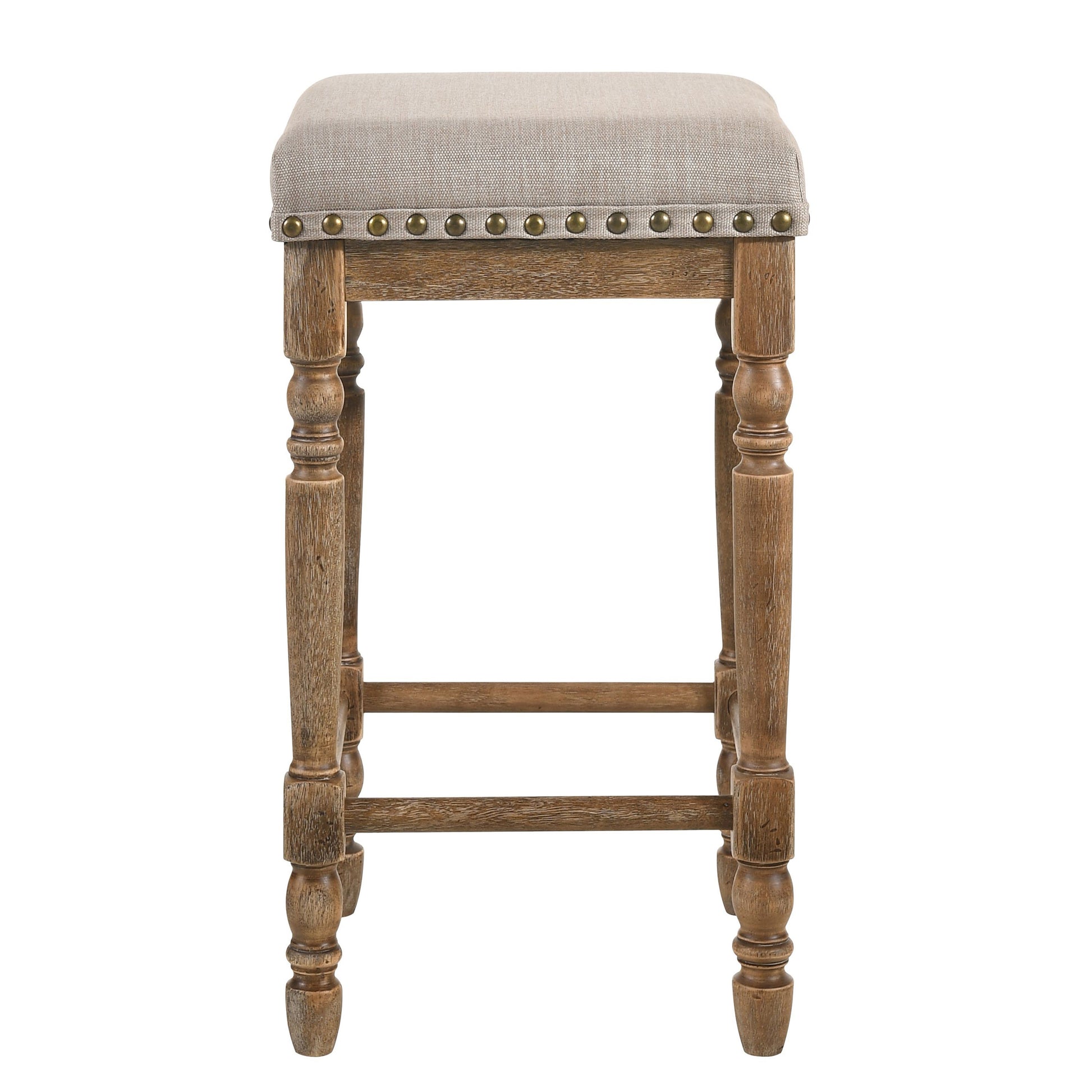 Rustic carved wooden bar stool with a natural linen upholstered seat and brass nailhead trim