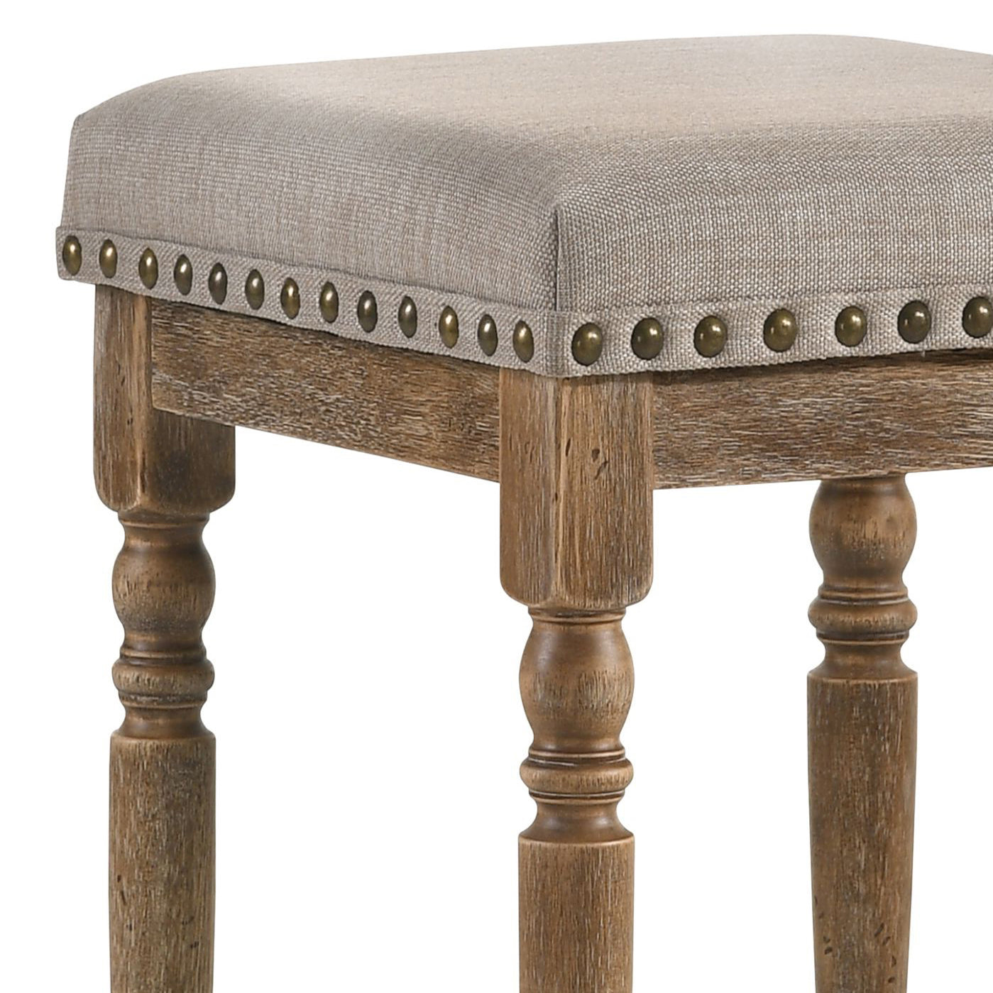 Upholstered vanity stool with nailhead trim and carved wood legs