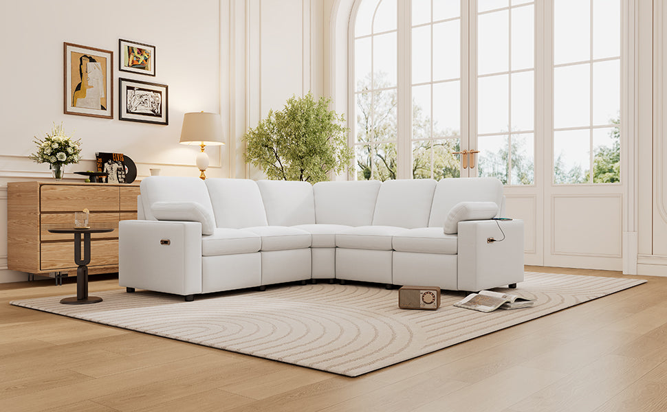 Modern white sectional sofa with power recliner and USB charging station in a bright living room