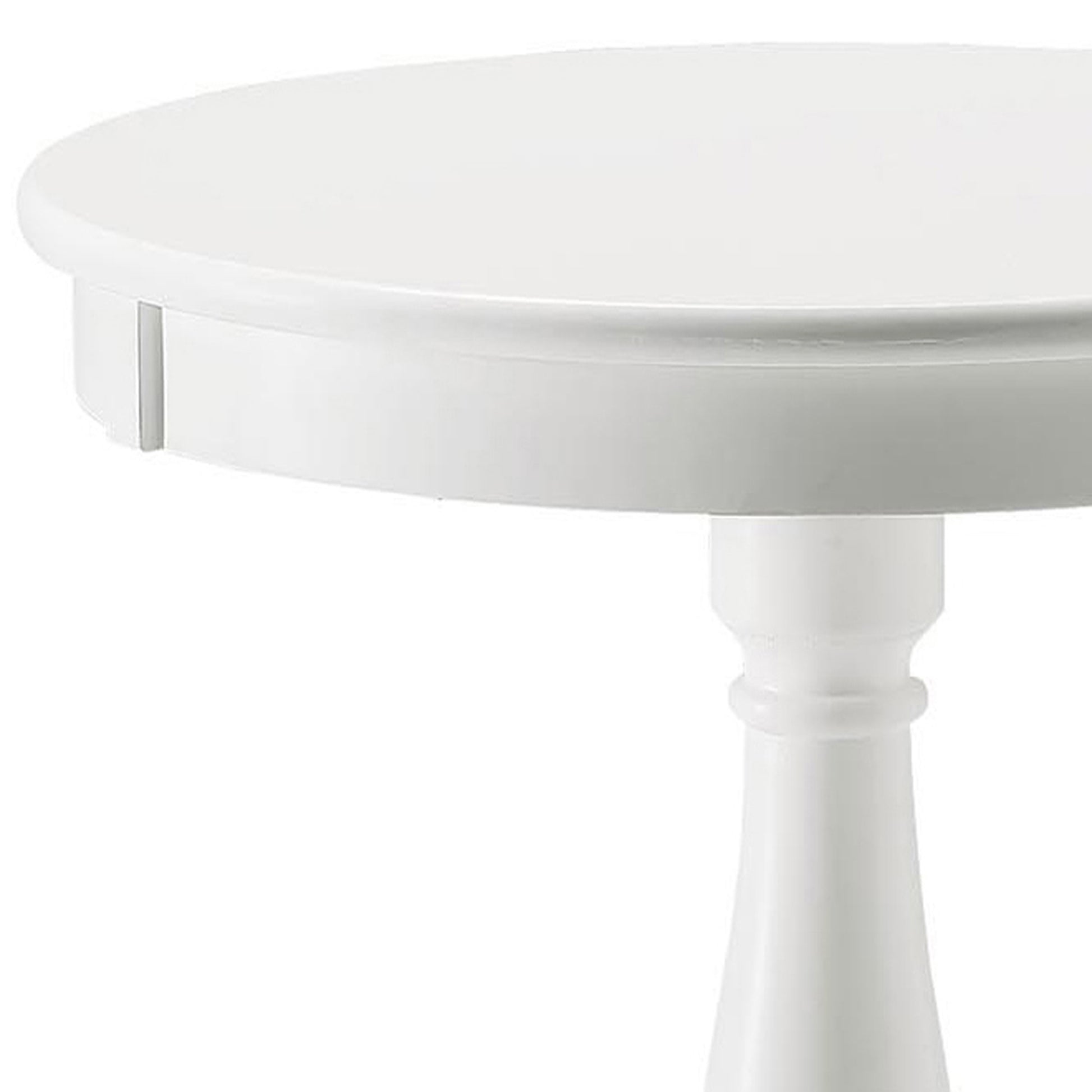 Closeup of a glossy white round side table with a turned pedestal base