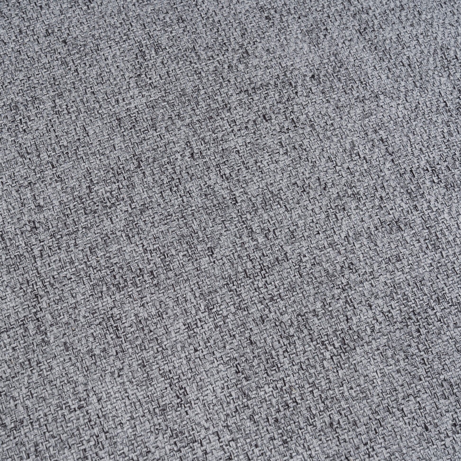 Closeup of textured grey upholstery fabric with a woven pattern perfect for furniture