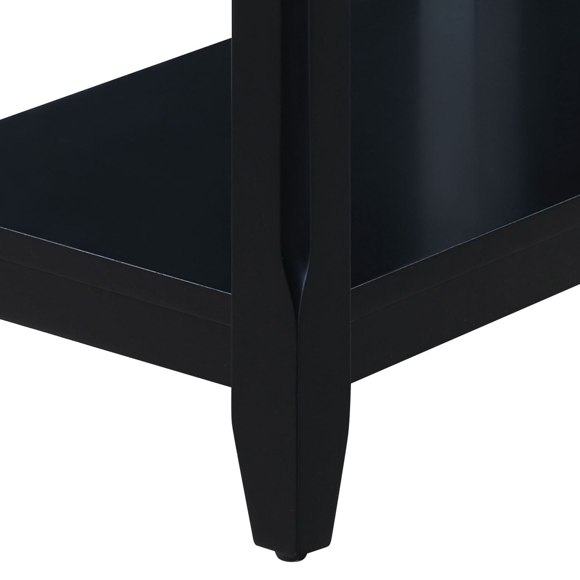 Black modern end table leg with carved detail showcasing sleek wood craftsmanship