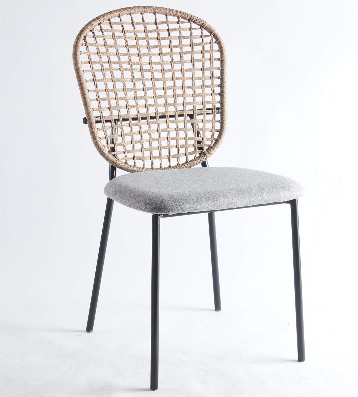 Woven natural fiber dining chair with a grey fabric seat and black metal legs