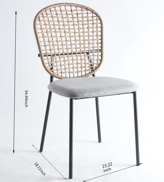 Woven natural fiber back dining chair with grey upholstered seat and black metal legs