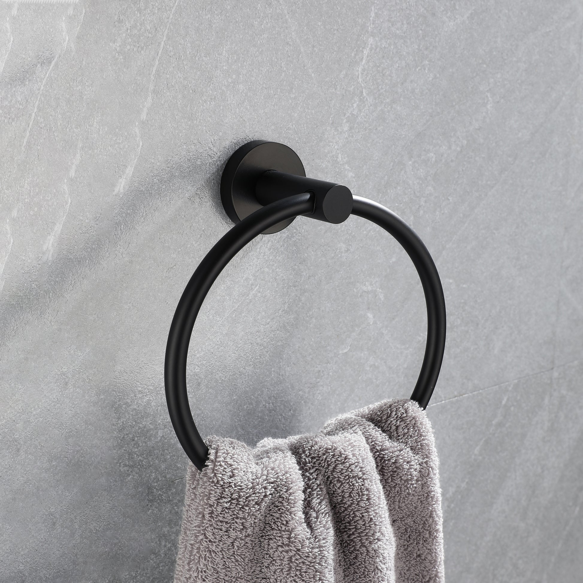 Modern matte black towel ring with a grey plush towel ideal for contemporary bathrooms