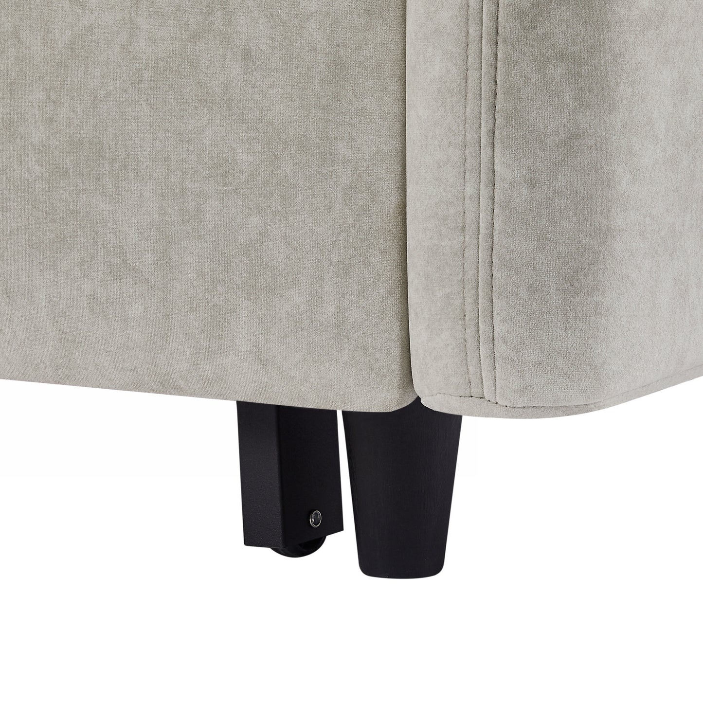 Close up of textured light gray sofa fabric with black legs