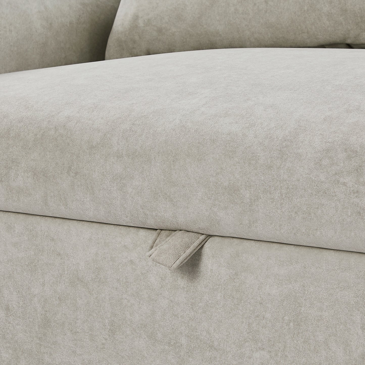 Light grey velvet sofa fabric with visible texture and pull tab