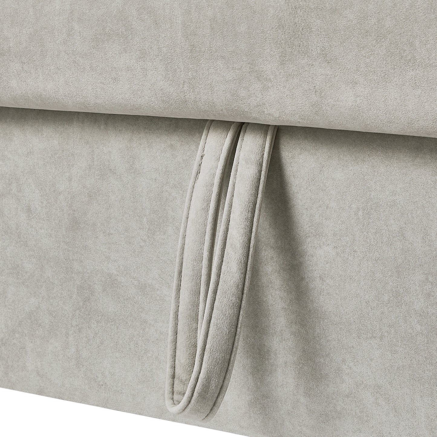 Closeup of light grey chenille fabric with a stitched loop handle detail ideal for upholstery