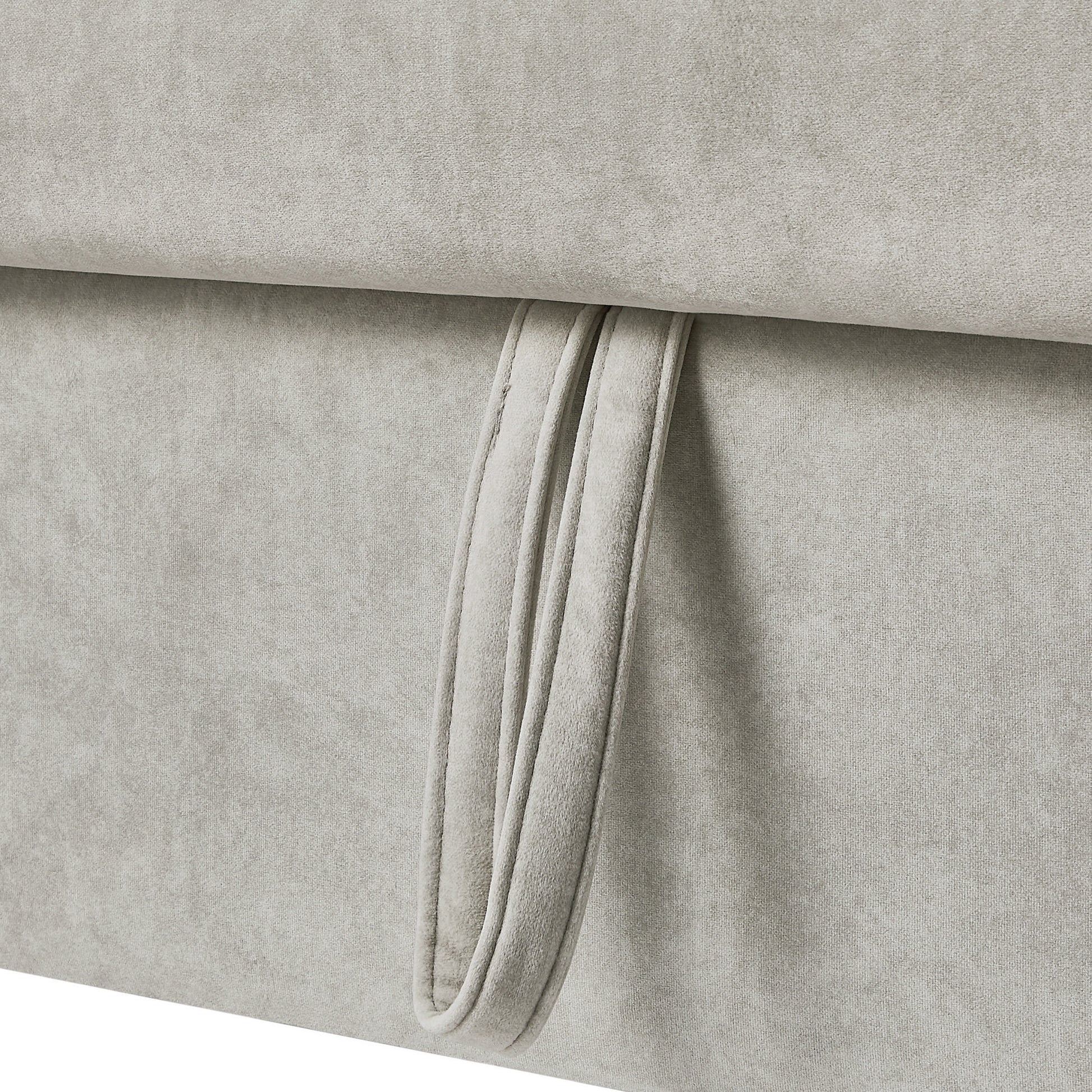 Closeup of light grey chenille fabric with a stitched loop handle detail ideal for upholstery