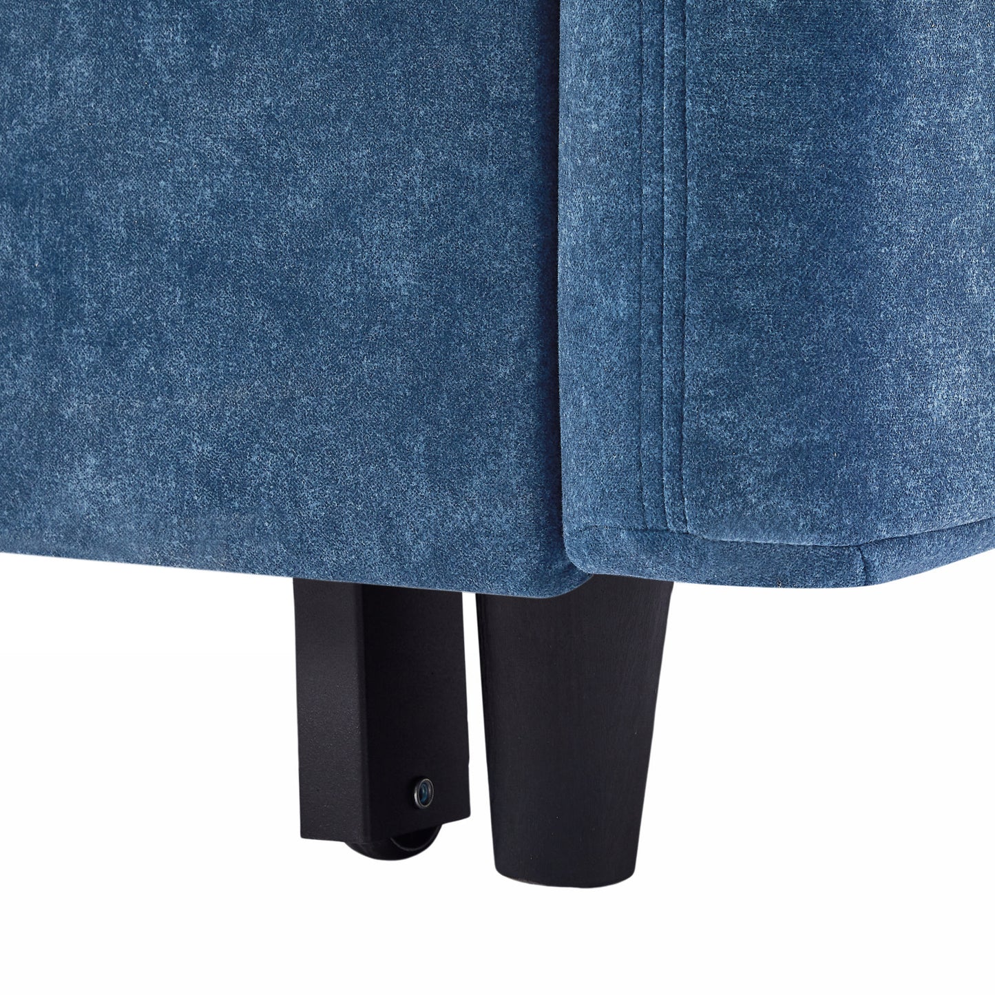 Closeup of a plush blue armchair fabric with black square legs showing texture