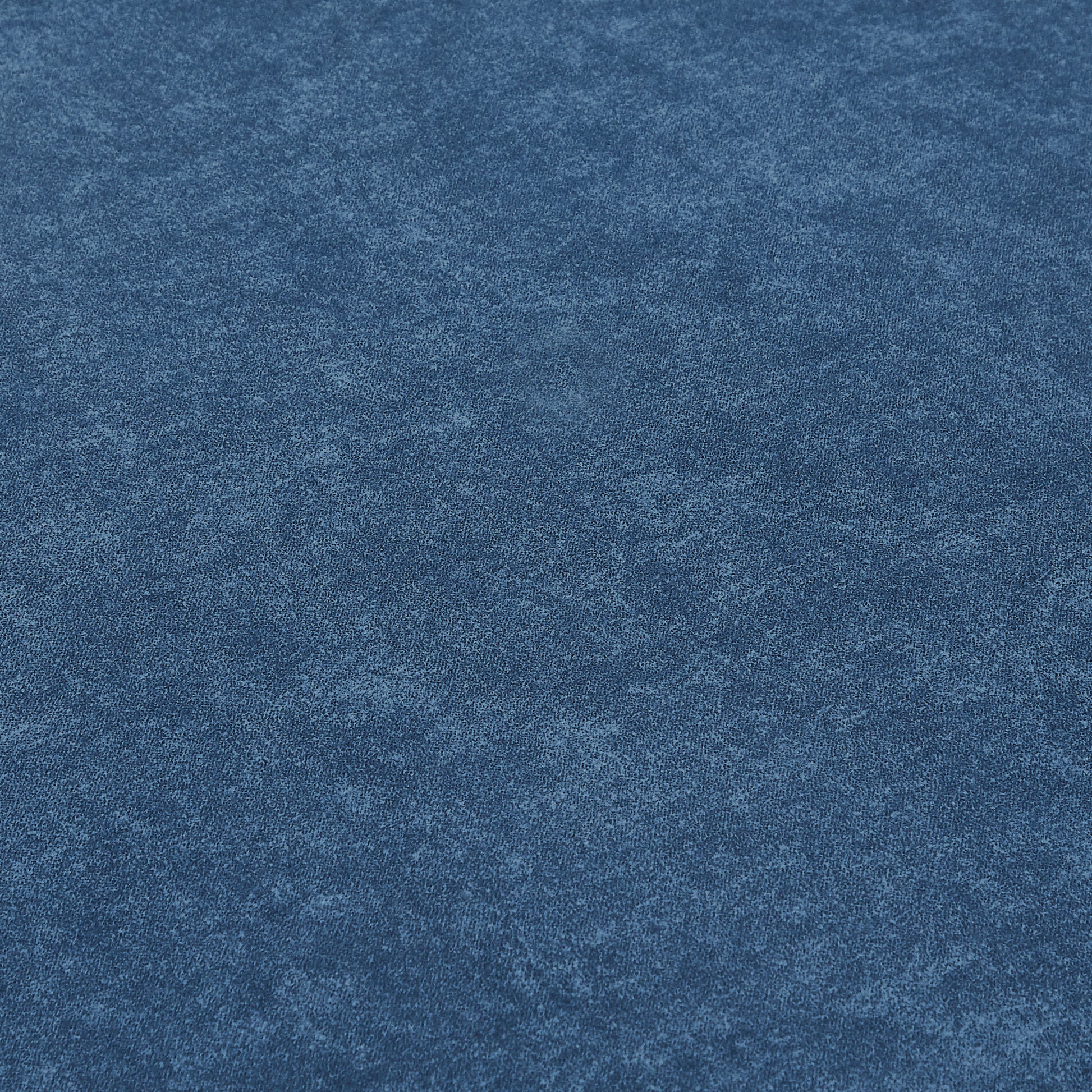 Textured navy blue faux suede fabric closeup