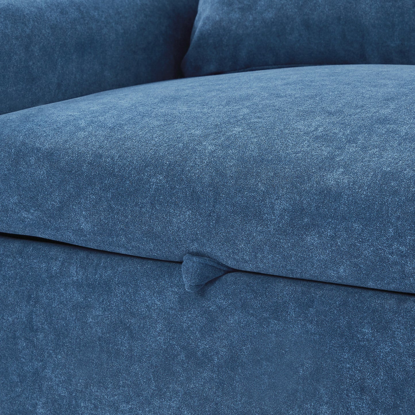 Closeup of textured dark blue velvet upholstery on a modern sofa