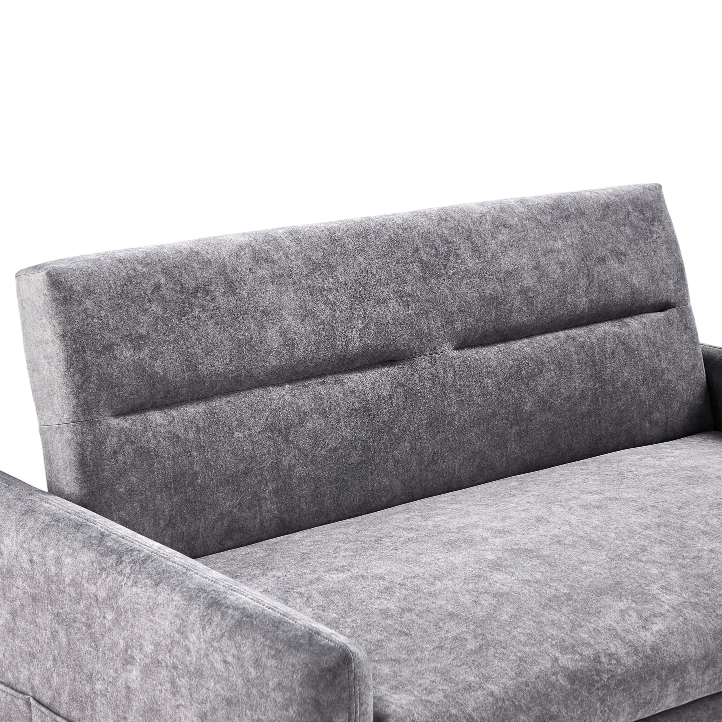 Closeup of a plush grey velvet sofa showcasing its textured fabric and modern stitching